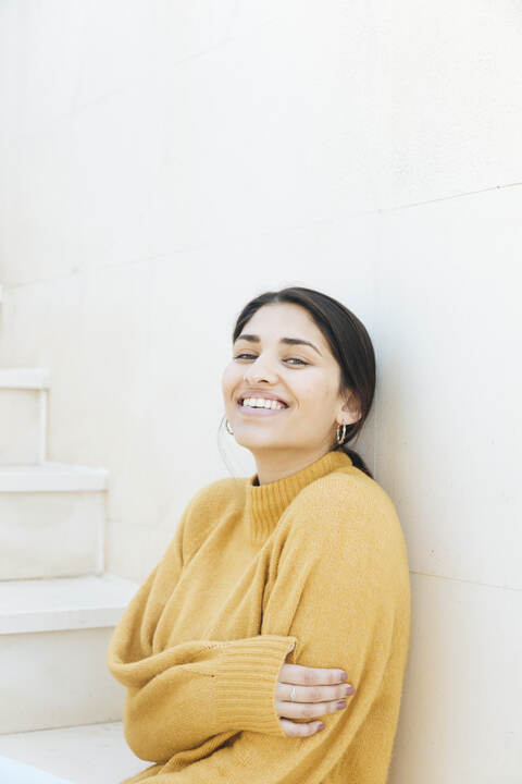 Woman smiling during a quiet moment in her health journey