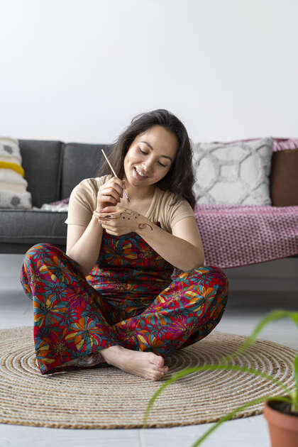 Woman relaxing at home while caring for her wellbeing